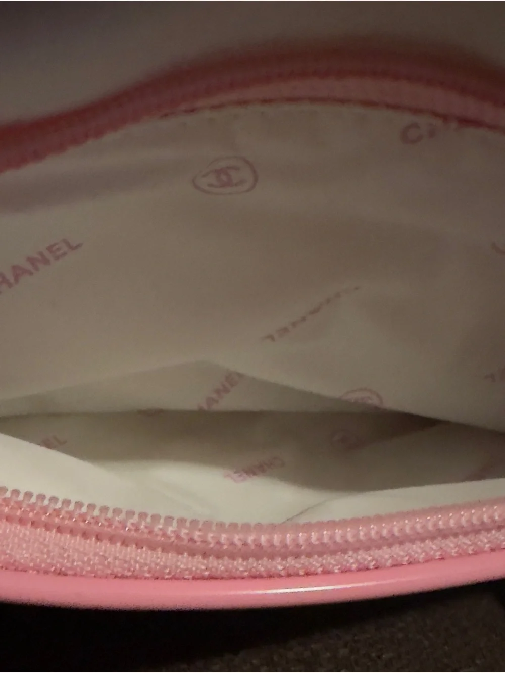 CHANEL White Cosmetic Pouch with Pink Trim. 9.25”W x 7”H.